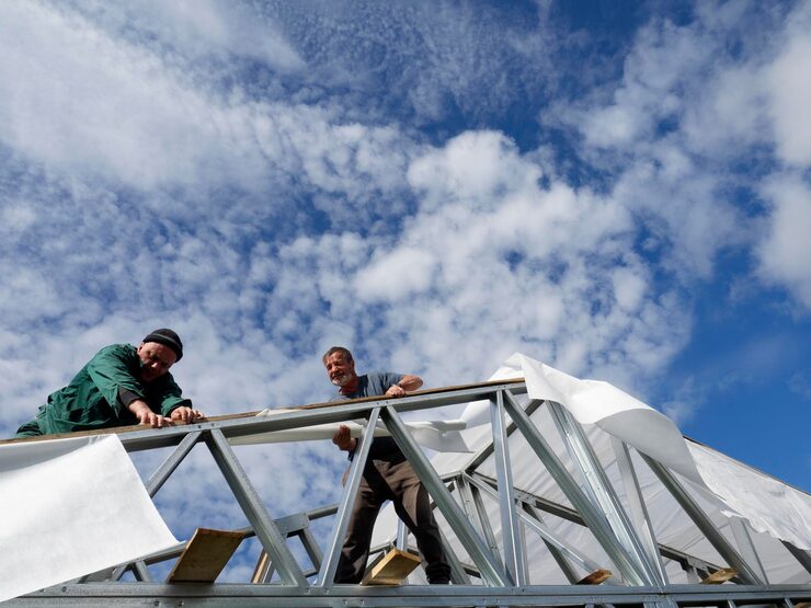 people working rooftop