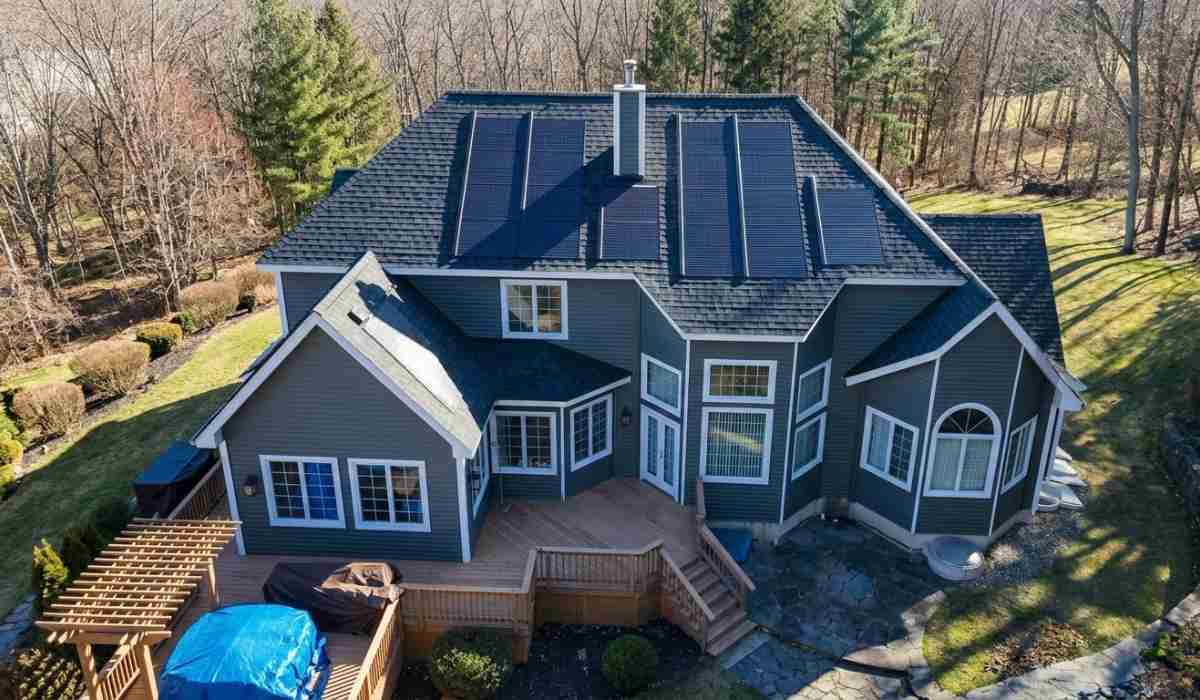 High-angle drone shot of a house with solar shingles