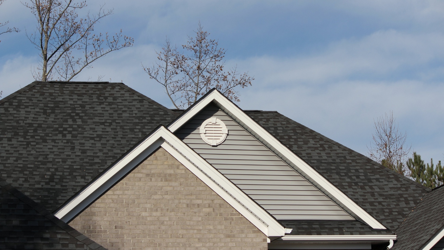 house roof with a mix of gable and hip rooflines