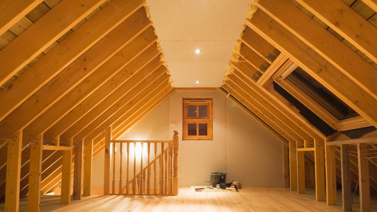 attic conversion showing exposed wooden rafters