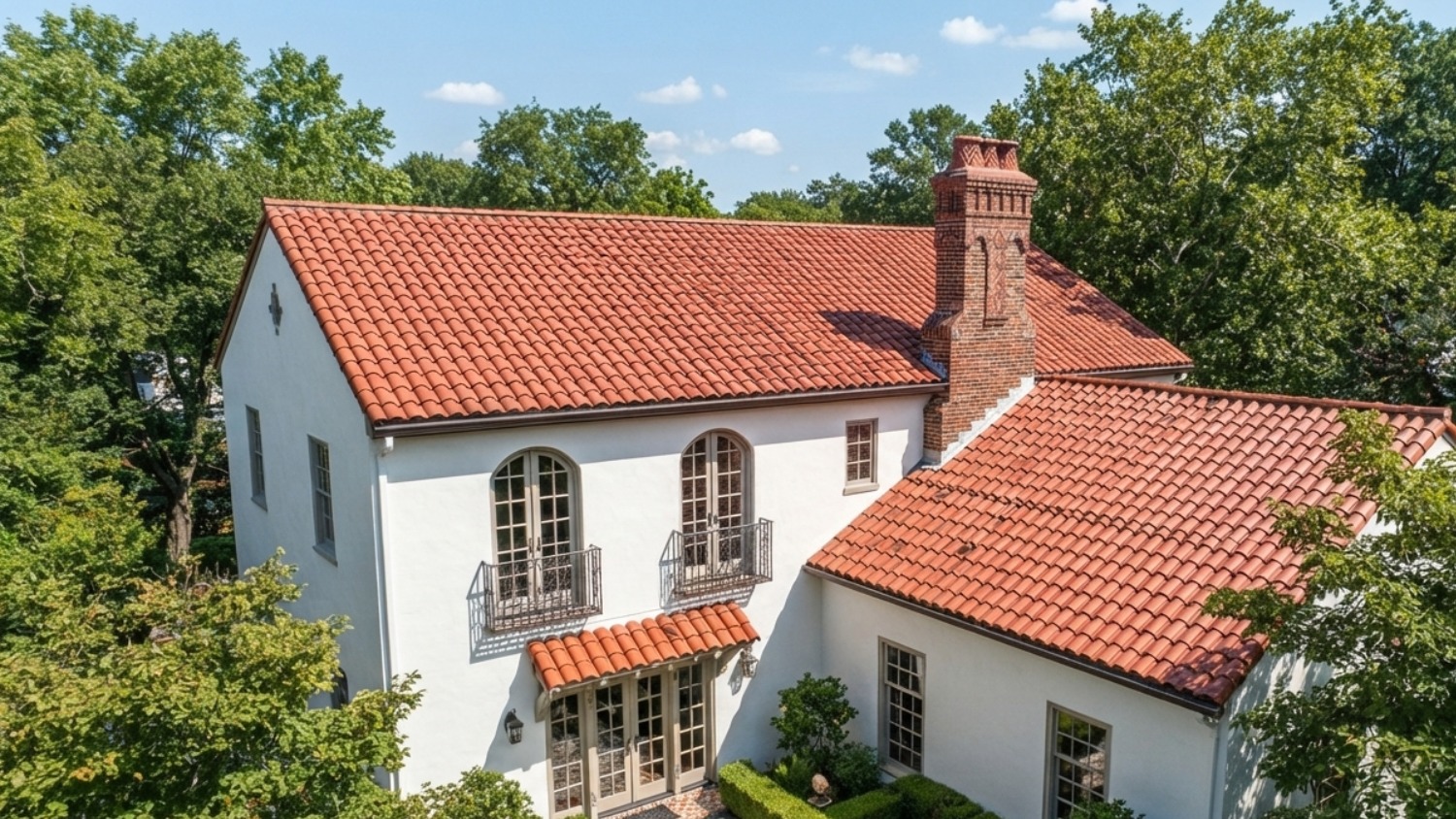 featuring a red clay tile roof