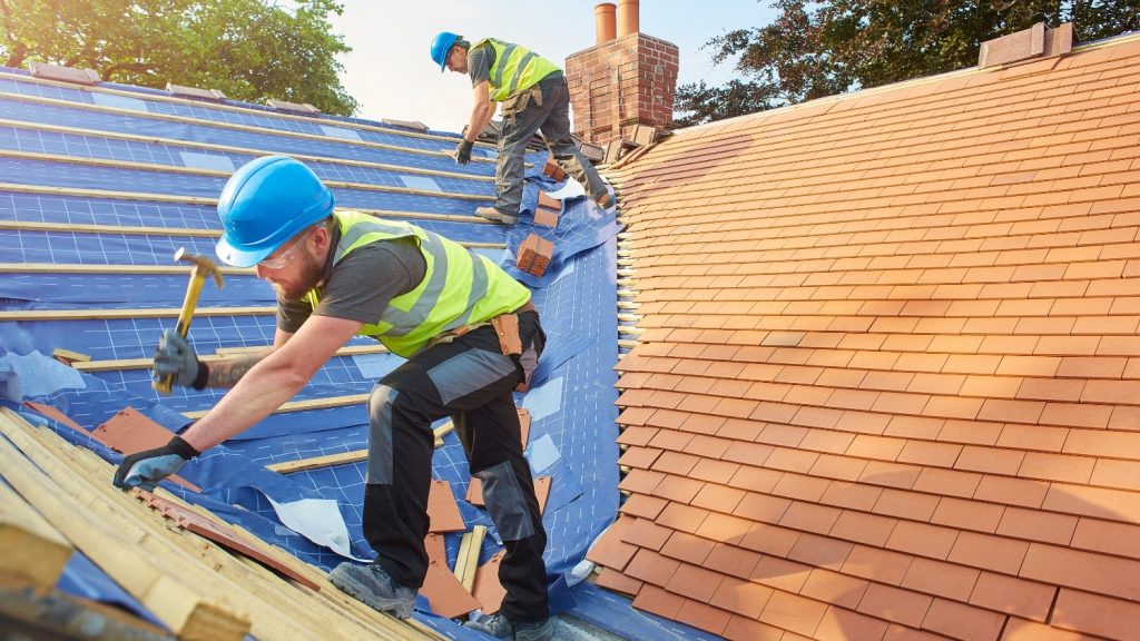 workers doing roof replacement