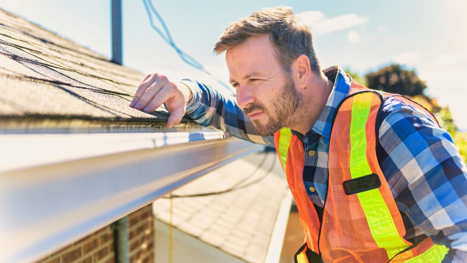 while inspecting a roof gutter
