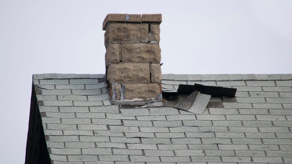 damaged shingles near the base