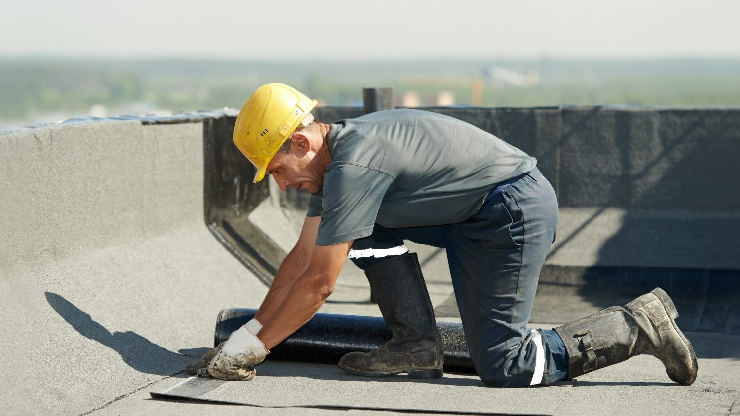 installing a roll of bitumen-based waterproofing membrane
