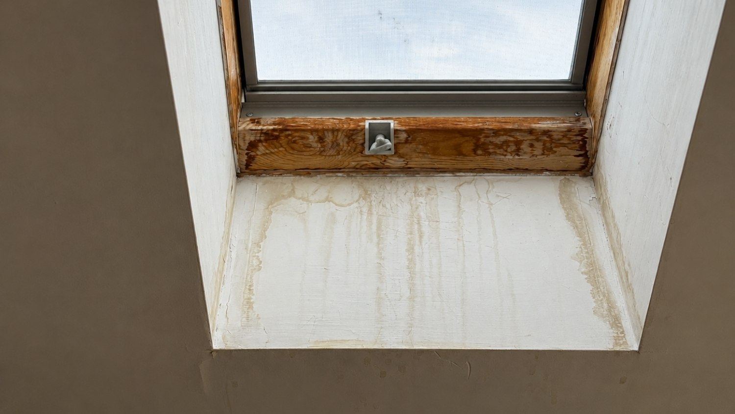 skylight window showing brown water stains